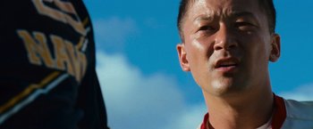 Movie still from “Battleship” (2012), directed by Peter Berg – A man's face in front of a blue sky; Close Up shot, Low angle