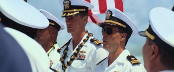 Movie still from “Battleship” (2012), directed by Peter Berg – A group of men in military uniforms standing next to each other in front of an american flag; Medium shot, Low angle