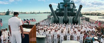 Movie still from “Battleship” (2012), directed by Peter Berg – A large group of sailors standing on the deck of a ship; Wide shot, Over the shoulder angle