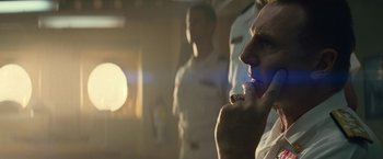 Movie still from “Battleship” (2012), directed by Peter Berg – A man brushing his teeth in front of two other men; Close Up shot, Over the shoulder angle