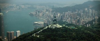 Movie still from “Battleship” (2012), directed by Peter Berg – A view of a large statue of a buddha on top of a hill; Extreme Wide shot, High angle