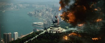 Movie still from “Battleship” (2012), directed by Peter Berg – An aerial view of a statue of a buddha on top of a hill; Extreme Wide shot, High angle