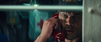 Movie still from “Battleship” (2012), directed by Peter Berg – A person talking on a phone; Close Up shot, Low angle