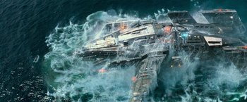 Movie still from “Battleship” (2012), directed by Peter Berg – An aerial view of an aircraft in the ocean; Extreme Wide shot, Overhead angle