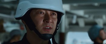 Movie still from “Battleship” (2012), directed by Peter Berg – A person wearing a helmet; Close Up shot, Over the shoulder angle