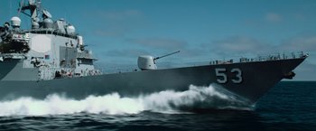Movie still from “Battleship” (2012), directed by Peter Berg – A large boat with a gun on the front of it; Extreme Wide shot, High angle