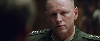 Movie still from “Battleship” (2012), directed by Peter Berg – A person wearing a military uniform; Close Up shot, Over the shoulder angle