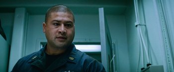 Movie still from “Battleship” (2012), directed by Peter Berg – A person wearing a uniform; Close Up shot, Low angle