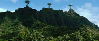 Movie still from “Battleship” (2012), directed by Peter Berg – A view of a mountain with trees in the foreground; Extreme Wide shot, Low angle