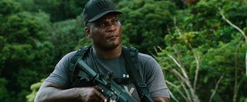 Movie still from “Battleship” (2012), directed by Peter Berg – A man holding an ar - 1 5 rifle in his hands; Close Up shot, Low angle