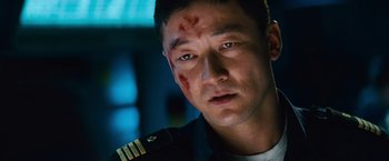 Movie still from “Battleship” (2012), directed by Peter Berg – A person with a bruise on his face; Close Up shot, Low angle