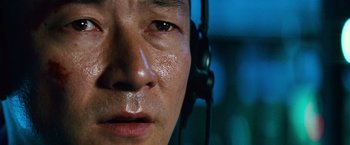 Movie still from “Battleship” (2012), directed by Peter Berg – A person wearing headphones; Extreme Close Up shot, Low angle