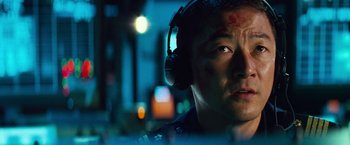 Movie still from “Battleship” (2012), directed by Peter Berg – A person wearing headphones; Close Up shot, Low angle