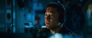 Movie still from “Battleship” (2012), directed by Peter Berg – A person wearing a headset; Close Up shot, Low angle