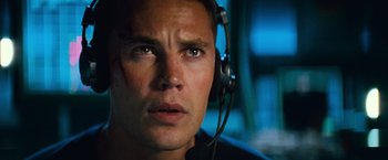 Movie still from “Battleship” (2012), directed by Peter Berg – A person wearing headphones; Close Up shot, Low angle