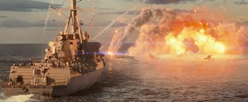 Movie still from “Battleship” (2012), directed by Peter Berg – A boat is in the water with a bunch of smoke coming out of it; Extreme Wide shot, High angle