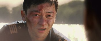 Movie still from “Battleship” (2012), directed by Peter Berg – A person with blood on his face; Close Up shot, Low angle