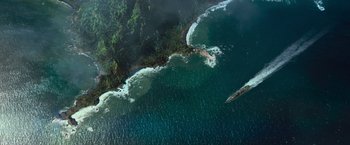 Movie still from “Battleship” (2012), directed by Peter Berg – An aerial view of a body of water with waves crashing on it; Extreme Wide shot, Overhead angle