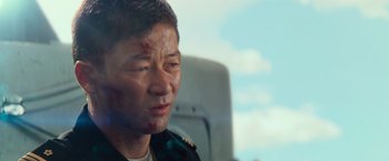 Movie still from “Battleship” (2012), directed by Peter Berg – A person with a bruise on his face; Close Up shot, Low angle