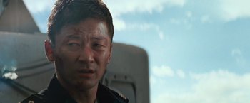 Movie still from “Battleship” (2012), directed by Peter Berg – A person wearing a military uniform; Close Up shot, Low angle