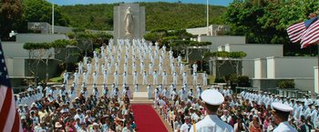 Movie still from “Battleship” (2012), directed by Peter Berg – A large crowd of people in front of a statue; Extreme Wide shot, High angle