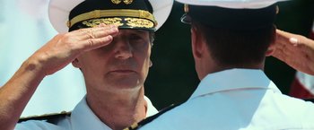 Movie still from “Battleship” (2012), directed by Peter Berg – A man in a uniform saluting another man in a uniform; Close Up shot, Low angle