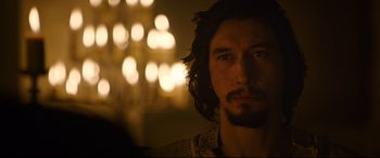 Movie still from “The Last Duel” (2021), directed by Ridley Scott – A person with a beard looking at the camera; Close Up shot, Over the shoulder angle