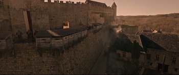 Movie still from “The Last Duel” (2021), directed by Ridley Scott – An image of an old castle in the middle of the night; Extreme Wide shot, High angle