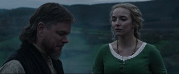 Movie still from “The Last Duel” (2021), directed by Ridley Scott – A man and a woman standing next to each other; Close Up shot, Over the shoulder angle