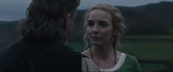 Movie still from “The Last Duel” (2021), directed by Ridley Scott – A man and a woman standing next to each other in a field; Close Up shot, Over the shoulder angle