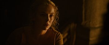 Movie still from “The Last Duel” (2021), directed by Ridley Scott – A beautiful young woman with long blonde curly hair; Close Up shot, Over the shoulder angle