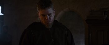 Movie still from “The Last Duel” (2021), directed by Ridley Scott – A person with a beard wearing a robe; Close Up shot, Low angle