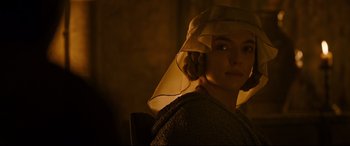 Movie still from “The Last Duel” (2021), directed by Ridley Scott – A woman with a veil on her head; Close Up shot, Over the shoulder angle