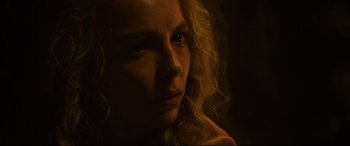 Movie still from “The Last Duel” (2021), directed by Ridley Scott – A person with curly hair; Close Up shot, Over the shoulder angle