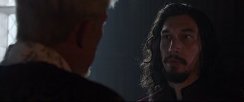 Movie still from “The Last Duel” (2021), directed by Ridley Scott – A man with long hair is talking to another man; Close Up shot, Over the shoulder angle