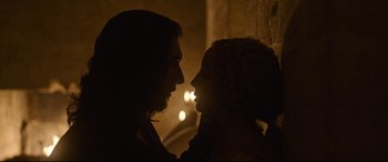 Movie still from “The Last Duel” (2021), directed by Ridley Scott – Two people are silhouetted against a wall; Close Up shot, Low angle