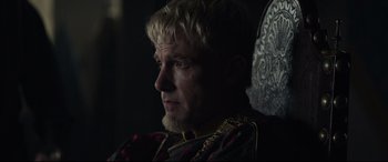 Movie still from “The Last Duel” (2021), directed by Ridley Scott – A person sitting in a chair; Close Up shot, Over the shoulder angle