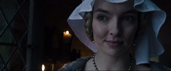 Movie still from “The Last Duel” (2021), directed by Ridley Scott – A person wearing a hat; Close Up shot, Over the shoulder angle