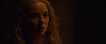 Movie still from “The Last Duel” (2021), directed by Ridley Scott – A person with long hair; Close Up shot, Over the shoulder angle