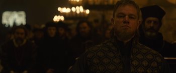 Movie still from “The Last Duel” (2021), directed by Ridley Scott – A person in a crowd of people; Close Up shot, Low angle