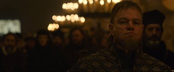 Movie still from “The Last Duel” (2021), directed by Ridley Scott – A person wearing a jacket; Close Up shot, Over the shoulder angle