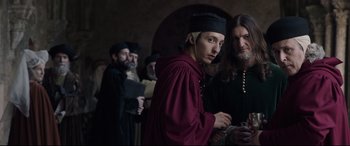 Movie still from “The Last Duel” (2021), directed by Ridley Scott – A group of men in medieval garb standing next to each other; Medium shot, Over the shoulder angle