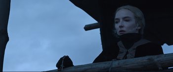 Movie still from “The Last Duel” (2021), directed by Ridley Scott – A woman standing on top of a wooden platform; Close Up shot, Low angle