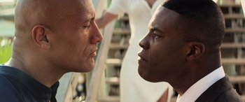 Movie still from “Baywatch” (2017), directed by Seth Gordon – Two men face each other in a close up picture; Close Up shot, Over the shoulder angle