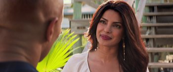 Movie still from “Baywatch” (2017), directed by Seth Gordon – A woman is smiling at a man in a white shirt; Close Up shot, Over the shoulder angle