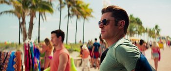 Movie still from “Baywatch” (2017), directed by Seth Gordon – A group of people walking along a beach; Close Up shot, Over the shoulder angle