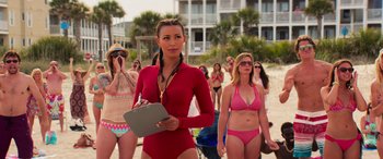 Movie still from “Baywatch” (2017), directed by Seth Gordon – A group of women in bathing suits on the beach; Medium shot, Over the shoulder angle