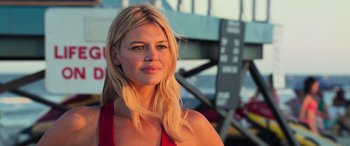 Movie still from “Baywatch” (2017), directed by Seth Gordon – A beautiful blonde woman with long blonde hair; Close Up shot, Low angle