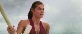 Movie still from “Baywatch” (2017), directed by Seth Gordon – A beautiful young lady wearing a red top; Close Up shot, Low angle