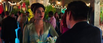 Movie still from “Baywatch” (2017), directed by Seth Gordon – A woman is talking to a man at a party; Close Up shot, Over the shoulder angle